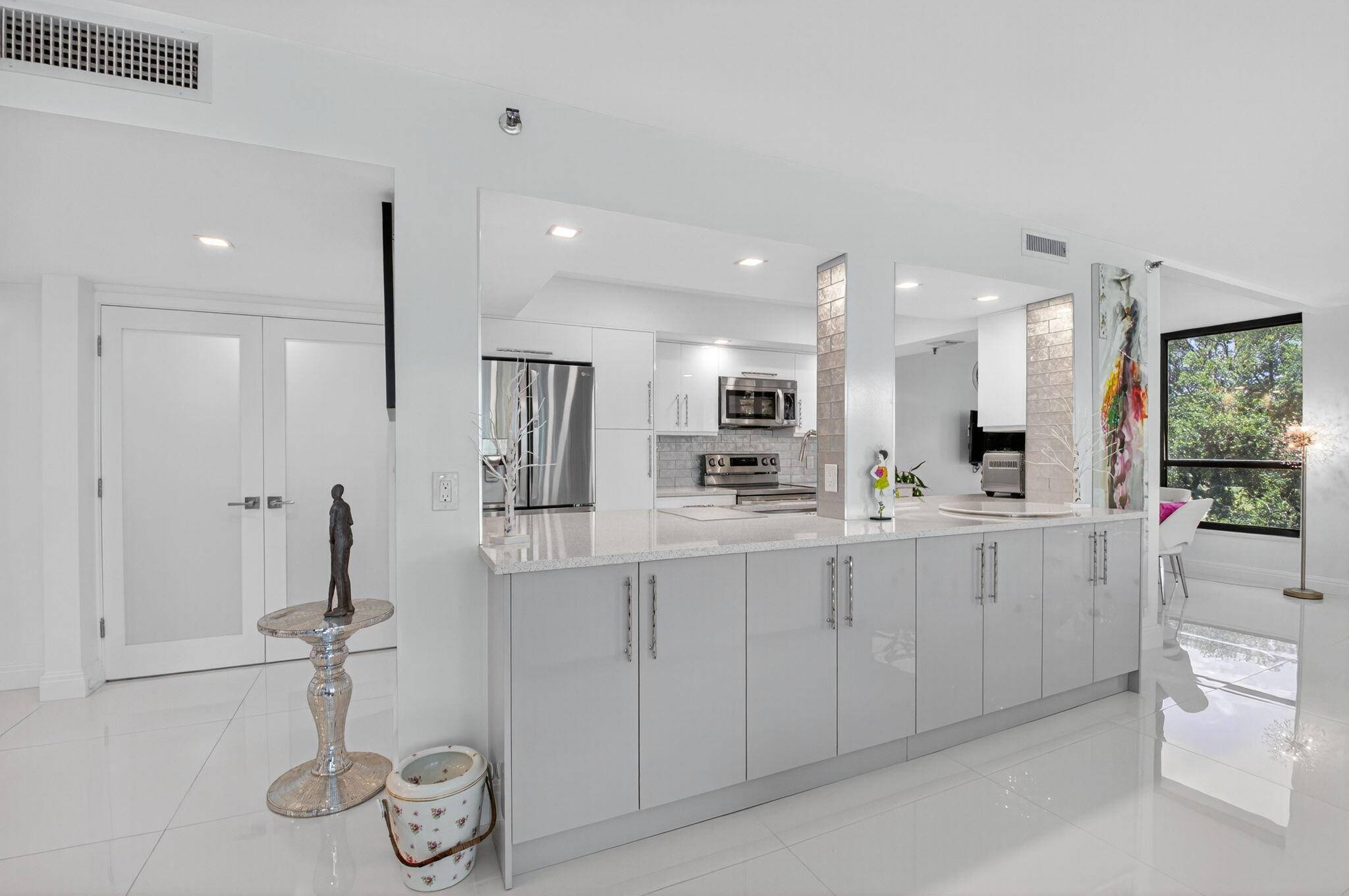 Discover luxury living in this beautifully renovated condo at Boca West Country Club.
