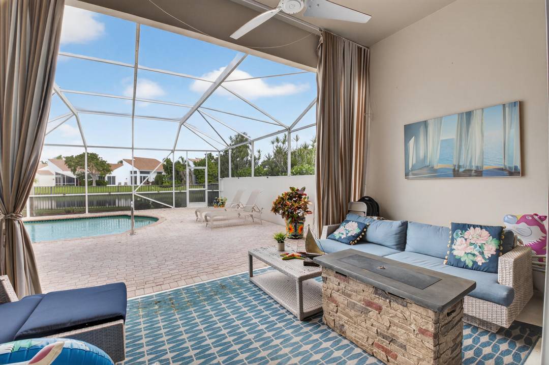 Newly Renovated 4 3 home with Spectacular Lake Views Huge Screened Pool Patio to enjoy year round for entertaining, featuring Cabana Drapery, right off the kitchen !