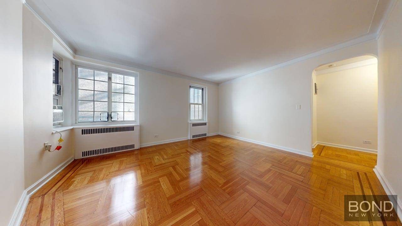 Massive studio features large living space, separate kitchen with stainless steel appliances and a dishwasher, windowed bathroom, hardwood floor and high ceilings.