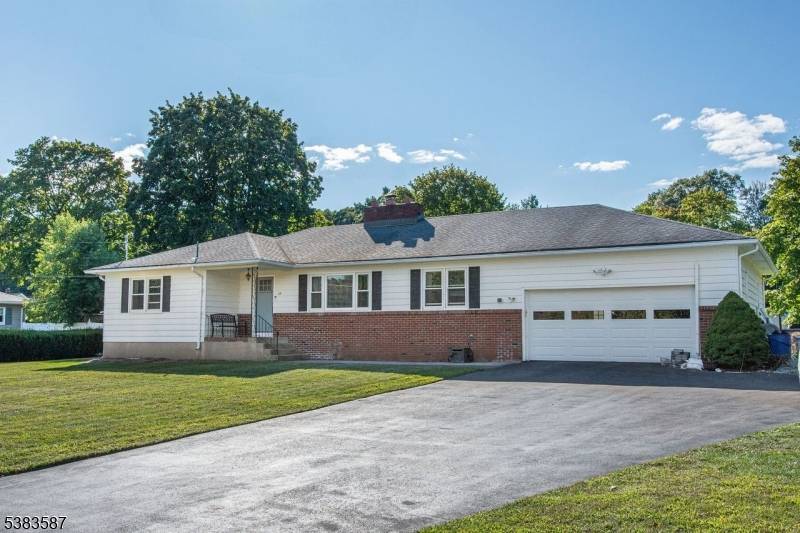 Welcome to your dream home at 25 Chase Drive, where sophistication meets comfort in this oversized 4 bedroom ranch that captivates from the moment you enter.