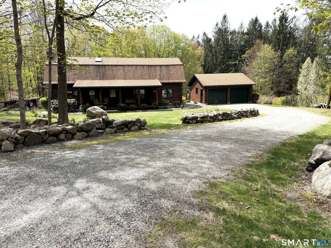 Nestled in a peaceful setting, this log home captures the warmth and character of a thoughtfully updated two level retreat.