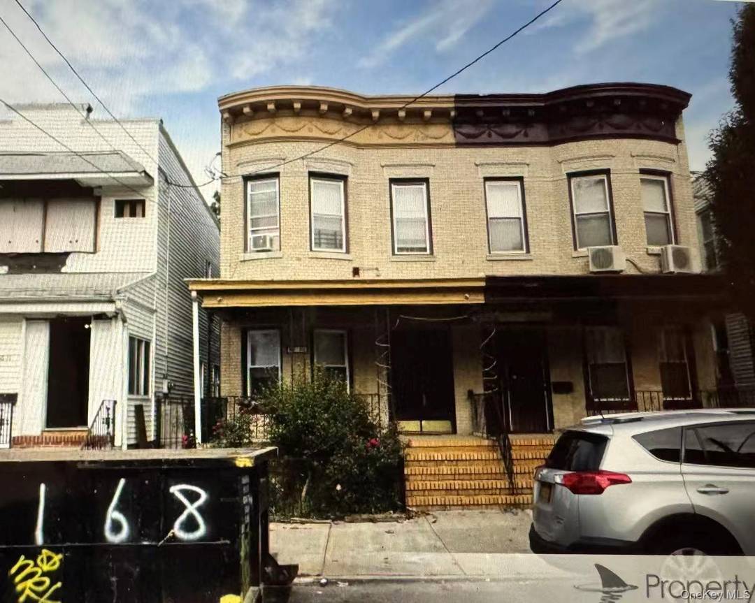 Single family detached brick house featuring 3 bedrooms and 2 bathrooms, with a fully finished basement that has a separate entrance.