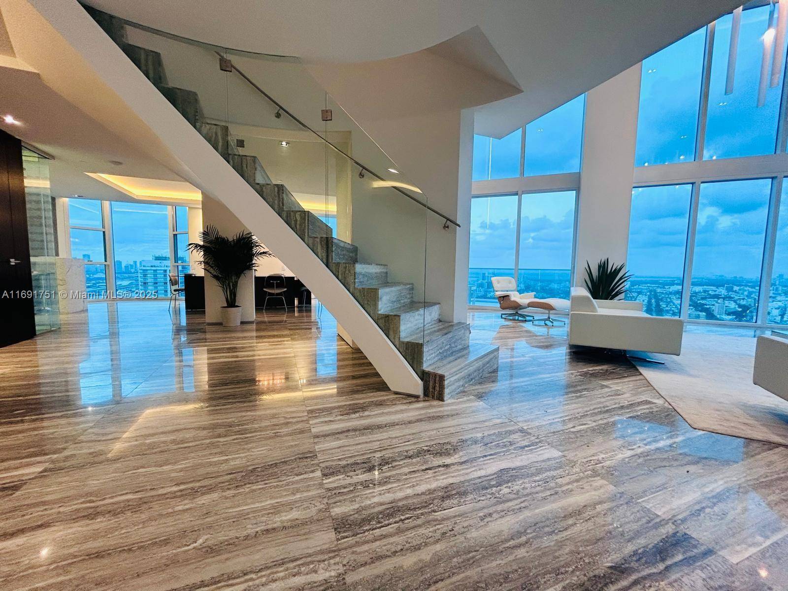 Completely Remodeled 4 units combined into 1 Big Penthouse Views 360 degree views of Atlantic Ocean, Biscayne Bay, Miami skyline Interior Industrial modern design with 18 ft ceilings, silver travertine ...