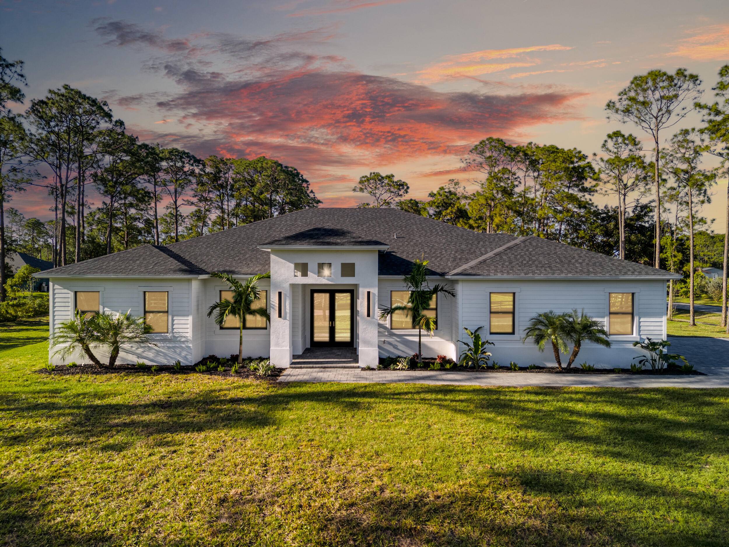 Ready for Immediate Delivery Monna Estate Homes Serena ModelSituated on a premium corner lot with paved road access, this stunning Serena Model is set on 1.