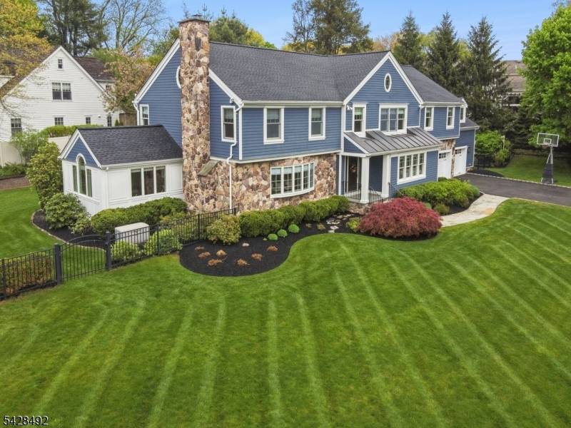 Nestled on a beautifully landscaped half acre in the highly desirable Rolling Hill neighborhood of Chatham, this 5 bedroom, 3.