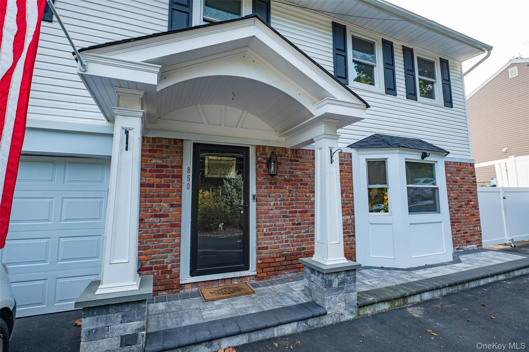 Beautiful 4 BR, 2. 5 bath Colonial, renovated 2021 includes LR, formal DR, EIK with white marble countertops, GE Cafe appliances, smart screen above stove, white cabinetry with gold tone ...