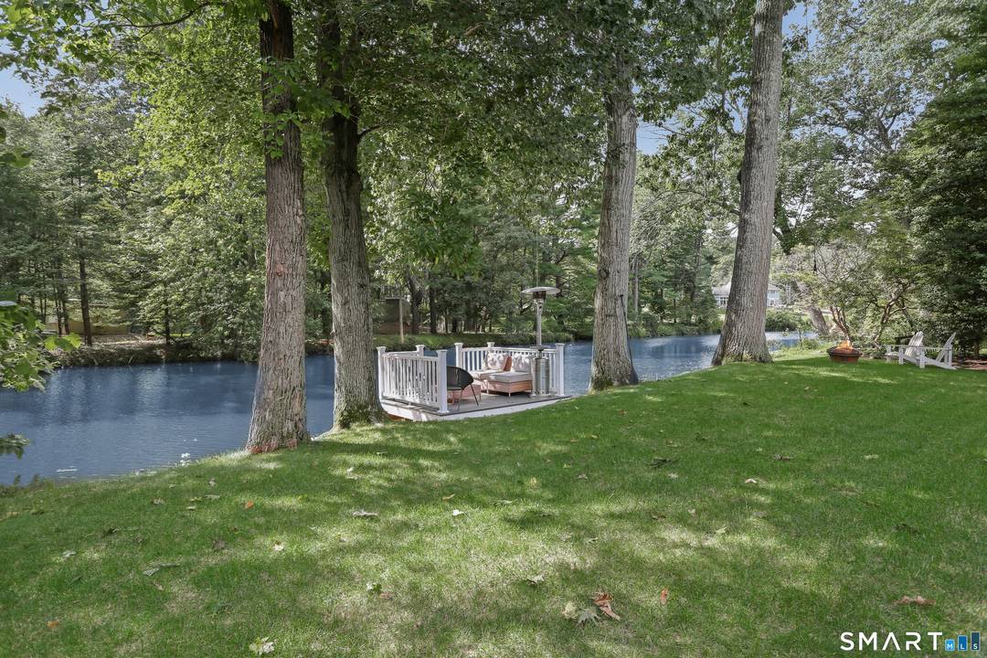 Nestled on the freshwater banks of the Saugatuck River, this extensively renovated refreshed custom built riverfront beauty sits high and dry with assumable flood insurance of approx.