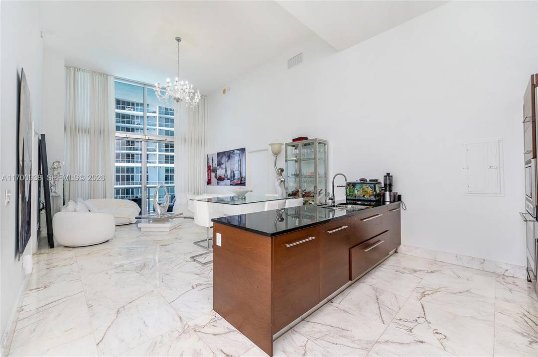 An exquisite 2 bed 2 bath den residence with breathtaking 16ft double height ceilings amp ; marble flooring throughout.