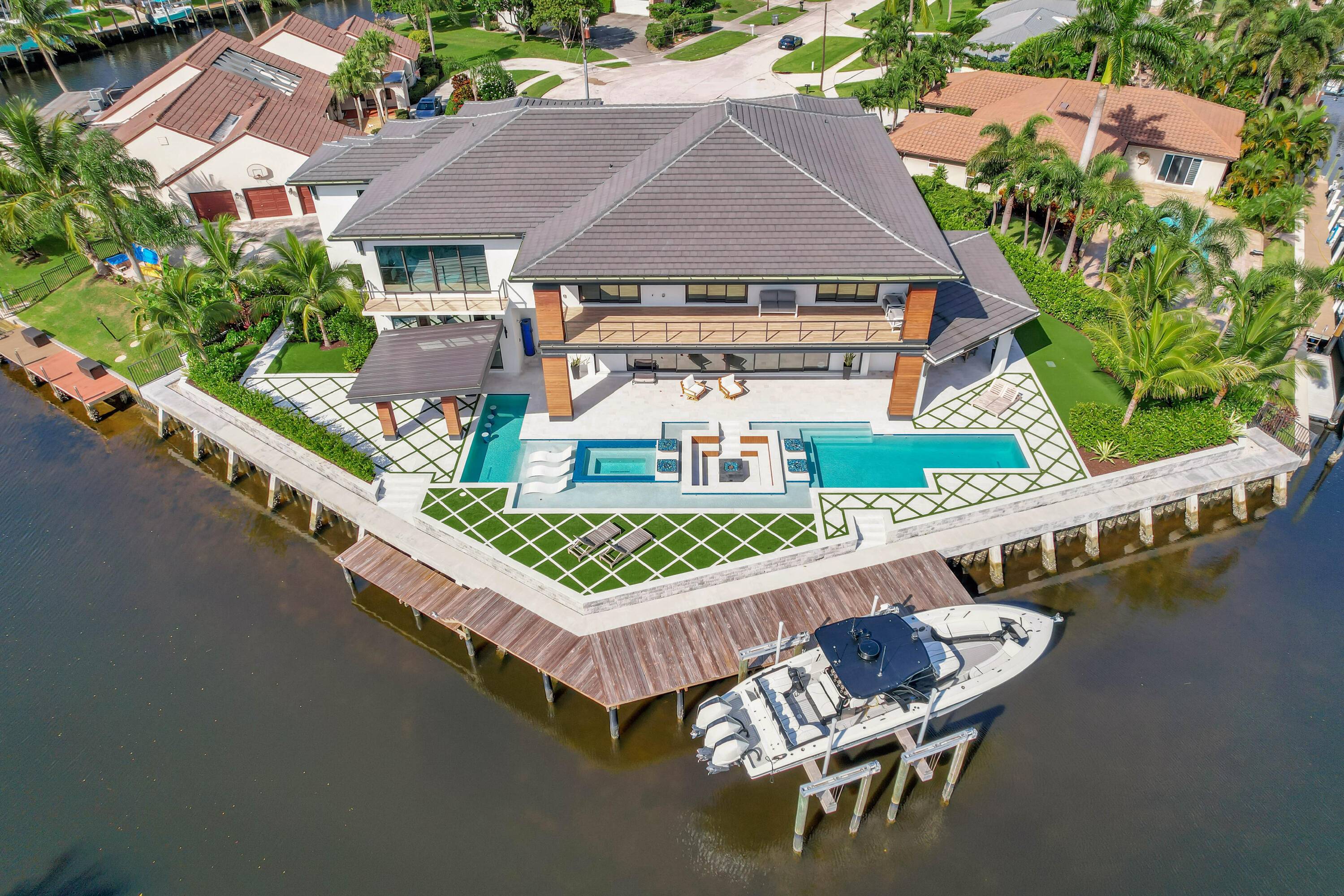 This stunning waterfront residence offers direct access to the Intracoastal Waterway in the heart of the Palm Beaches.