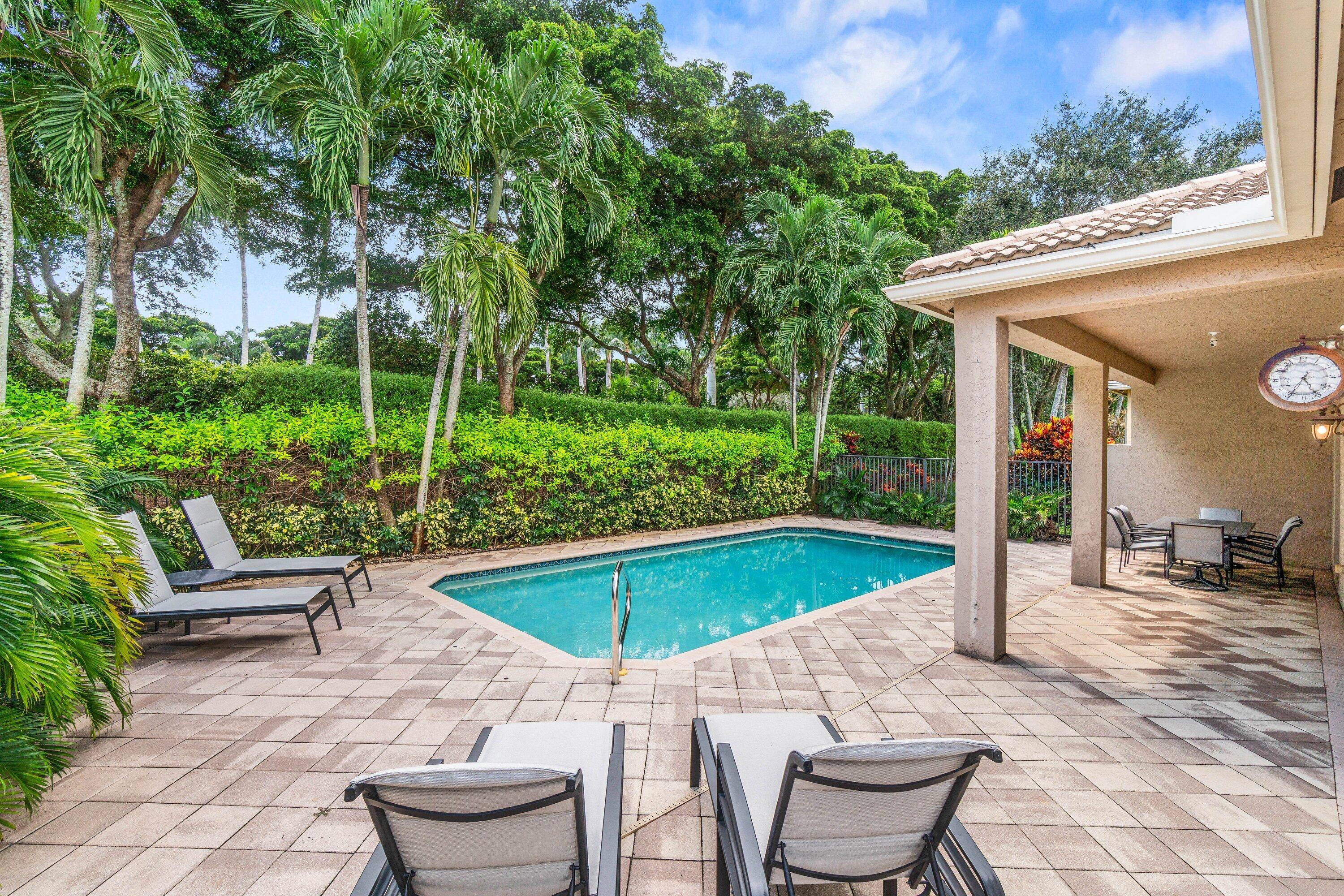 Lovely Catherine model features 2 bedrooms, 2 baths and a fenced in pool surrounded by landscaping providing beauty and privacy.