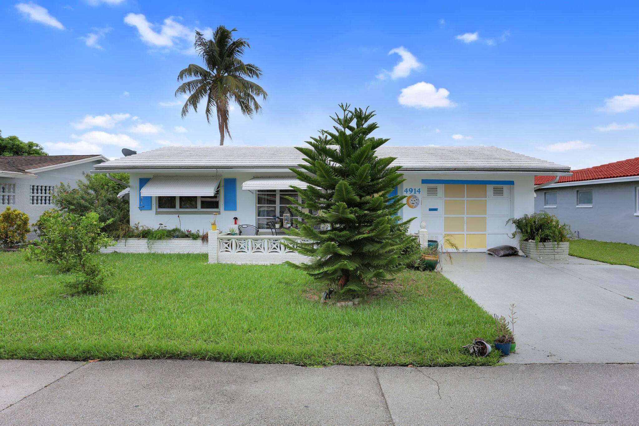 Classic Old Florida living in this charming home surrounded by a lush, tropical yard with your very own lemon and orange trees.