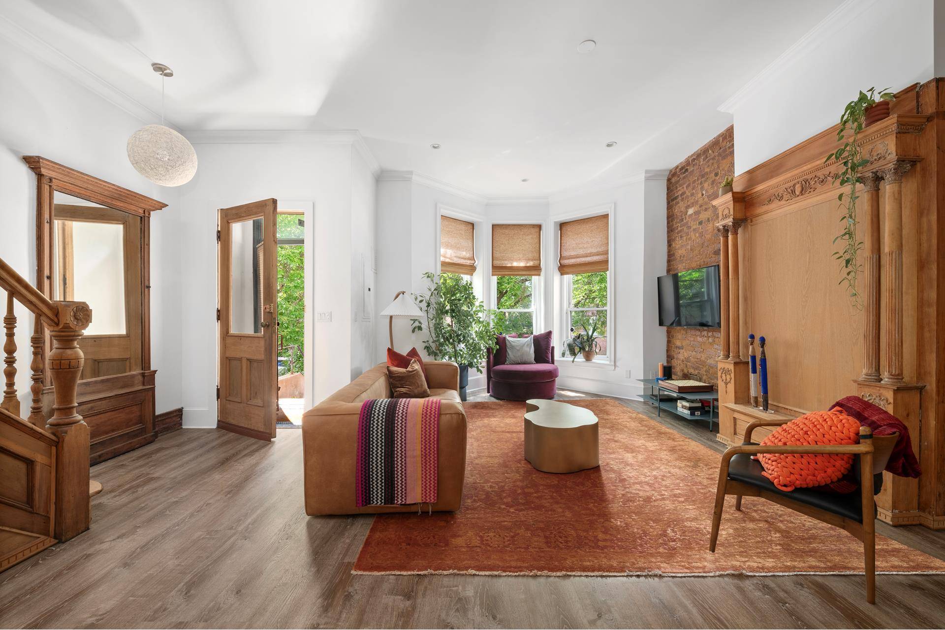 Stunning gut renovated townhouse with original wood details and a massive private backyard in the center of historic Crown Heights.