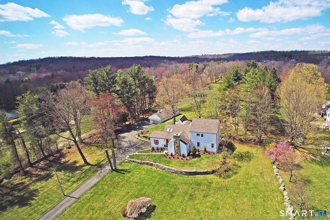 Nestled on 2 flat, open, fully fenced in acres is this masterfully renovated craftsman style farmhouse.