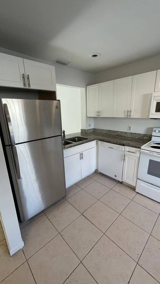 This two story townhouse, located in a well established all ages community in West Palm Beach, is currently part of a portfolio of four investment properties.