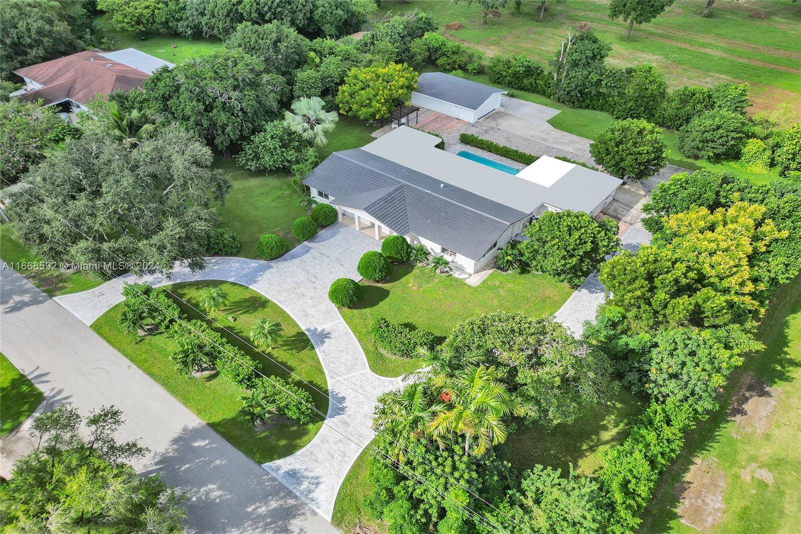 Step into a world of luxury with this fully renovated estate sprawling over an acre of lush land.