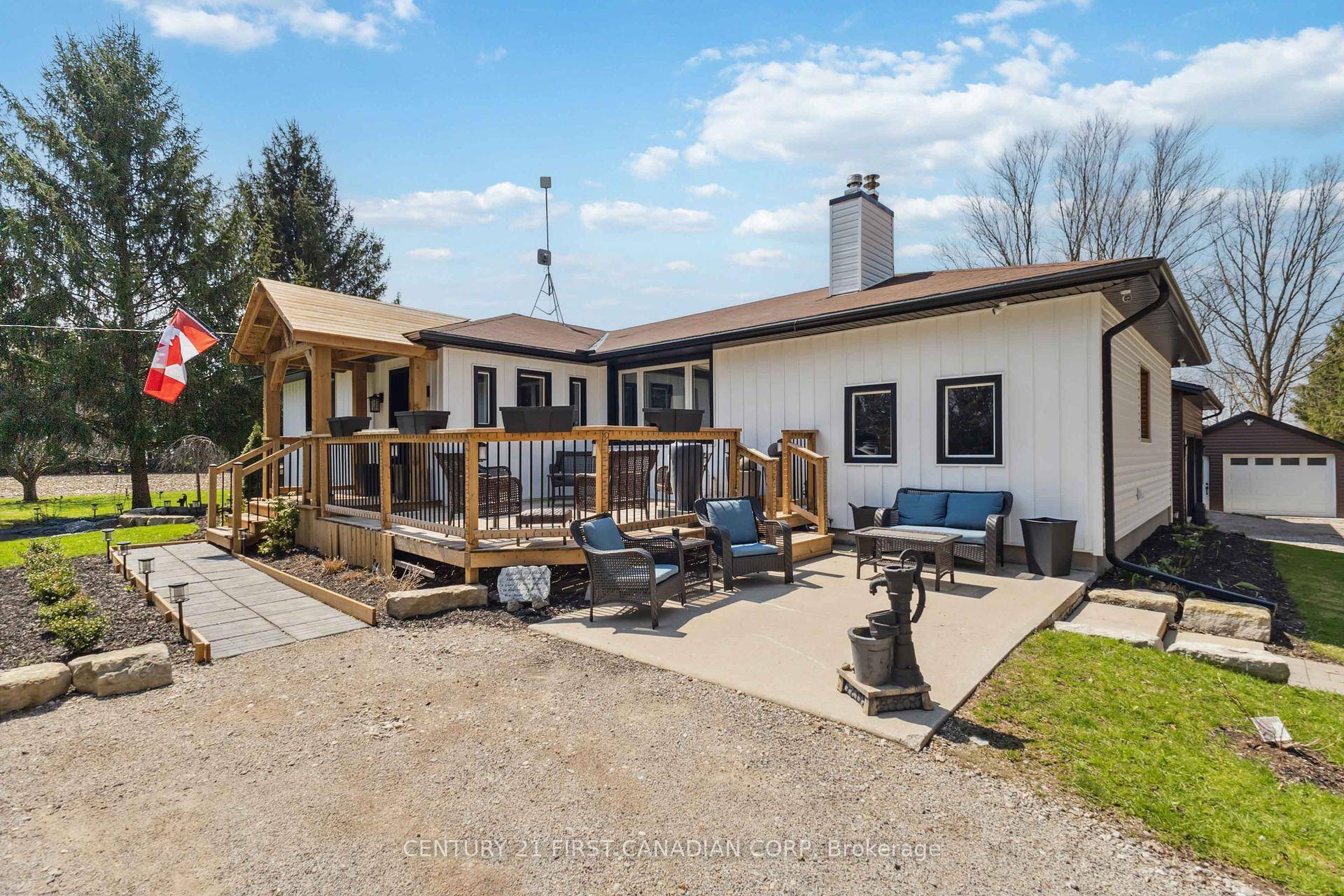Welcome to 20883 Rebecca Road, a beautifully renovated country estate on 1.