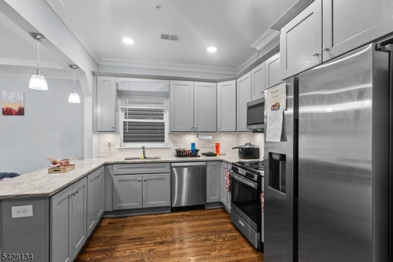 Newer construction two family home offering modern design and excellent income potential.