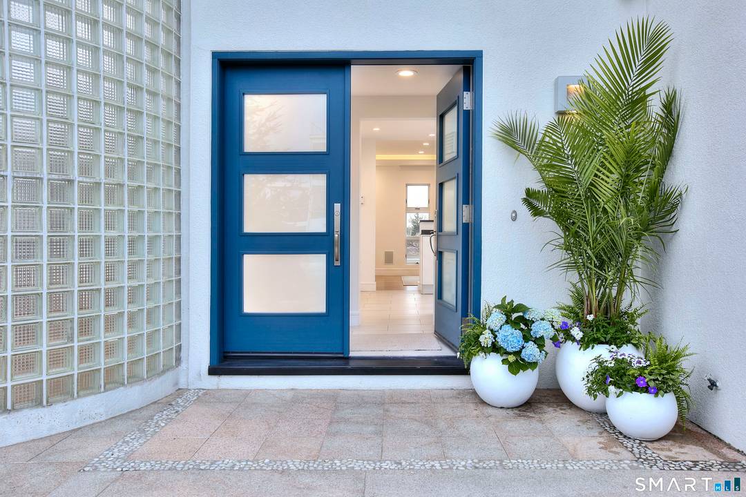 A rare convergence of water, light and privacy, this extraordinary waterfront home offers a lifestyle few ever experience.