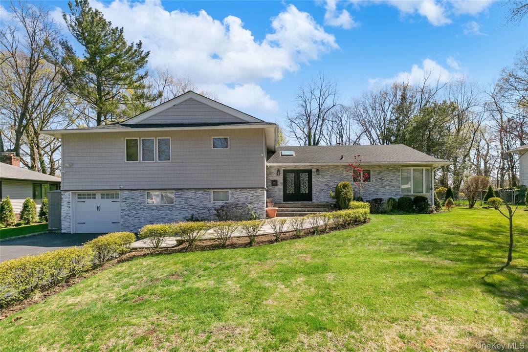 LAKE SUCCESS Totally Renovated Contemporary Split Level Home Gorgeous Designer Interiors Sly lit Entry Foyer Open Floor Plan Living Room Dining Room with Fireplace and Sliding Doors to Large Backyard ...