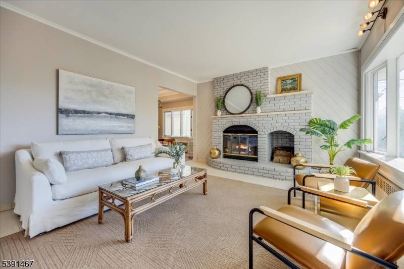 Welcome to this charming bright four bedroom colonial on a generous sized lot 37x211.