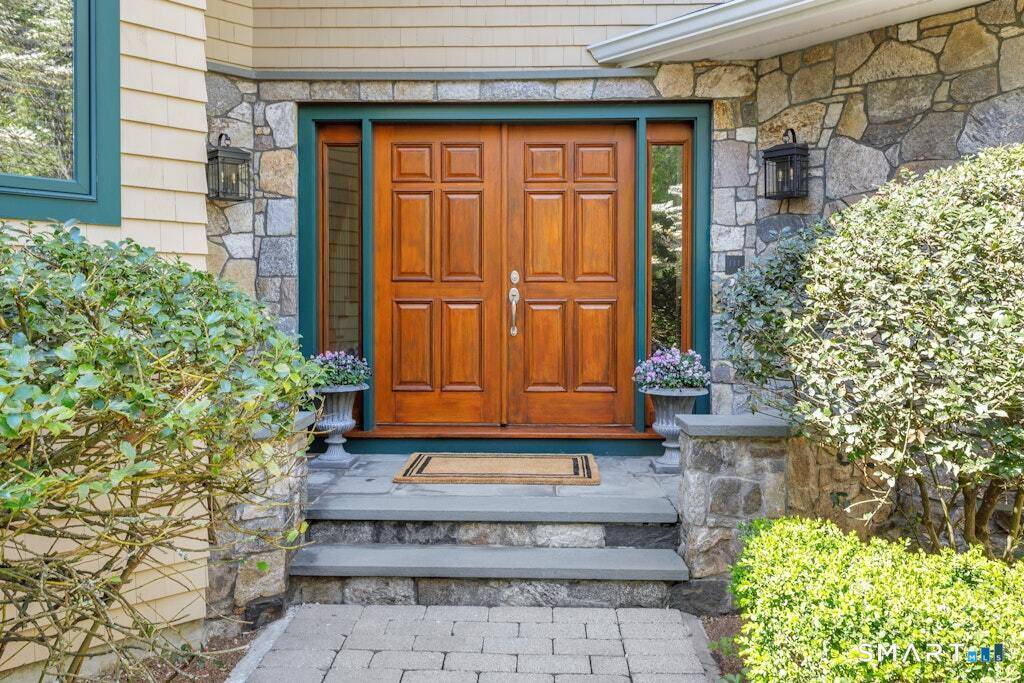 Experience refined luxury in this expansive Westover home, discreetly nestled at the end of a tranquil driveway just moments from schools, highways, transportation, and Stamford and Greenwich amenities.