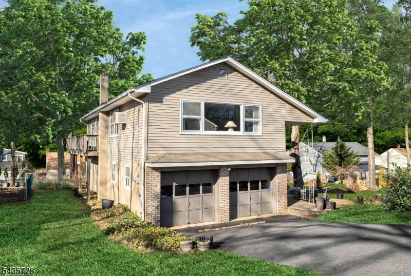 OPPORTUNITY KNOCKS ! Welcome to this very spacious raised ranch located in Landing and just steps away from Lake Hopatcong, New Jersey's largest lake.