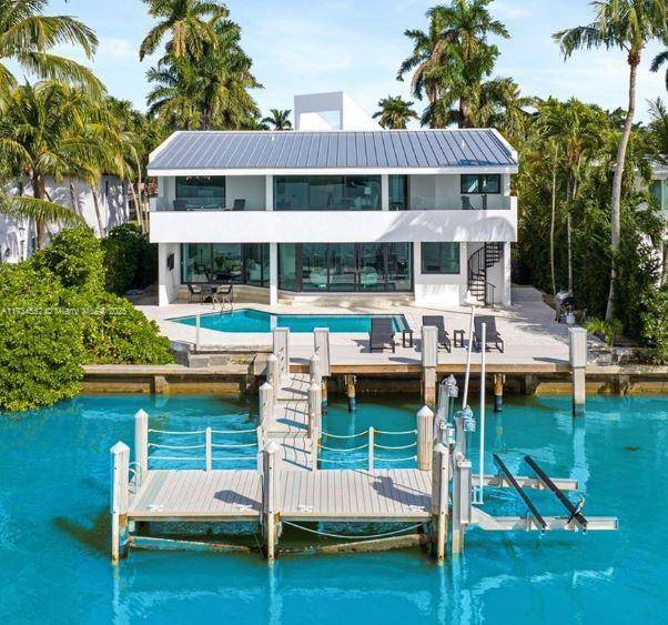 This waterfront home in the gated North Bay Island community offers stunning bay views.