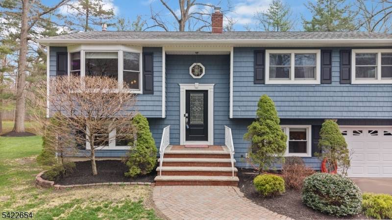 BRIGHT, BEAUTIFUL IMPECCABLY UPDATED 5 BED HOME ON TREE LINED, SIDEWALKED STREET.