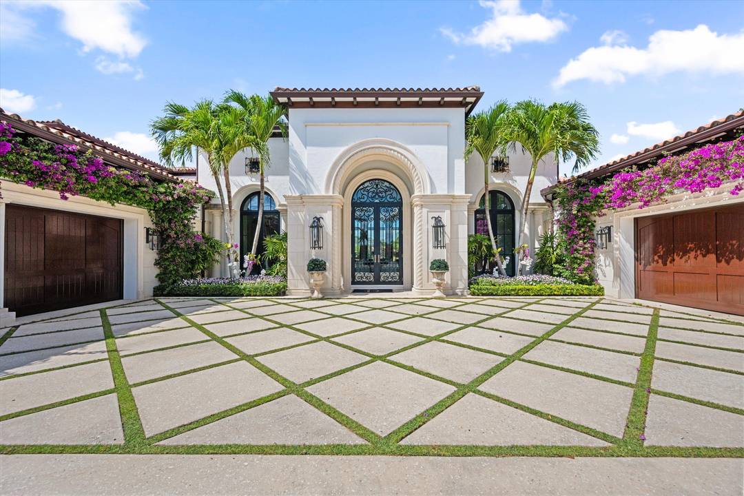 Welcome to 12521 Cypress Island Way, a stunning residence located in the prestigious gated enclave of Palm Beach Polo.
