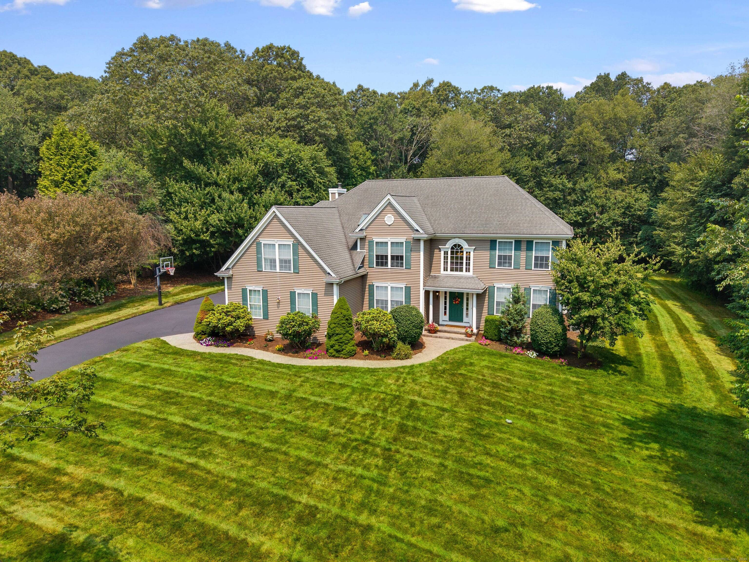 Welcome to 15 Harvest Glen, a stunning residence in one of East Lyme's most desirable neighborhoods.