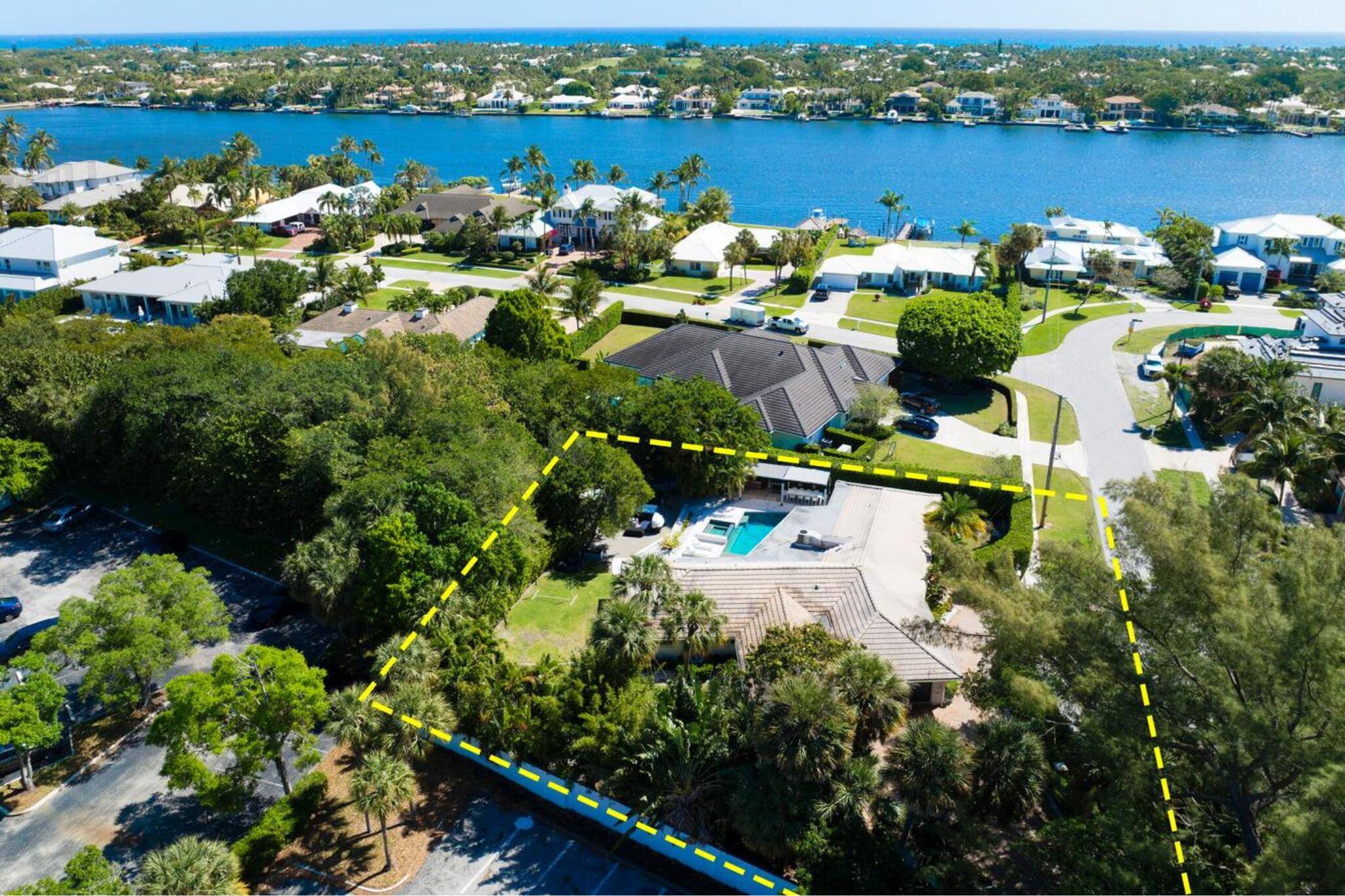 RARE WATERFRONT GEM IN PALM BEACH'S PREMIER NEIGHBORHOOD OF HIDDEN KEY !
