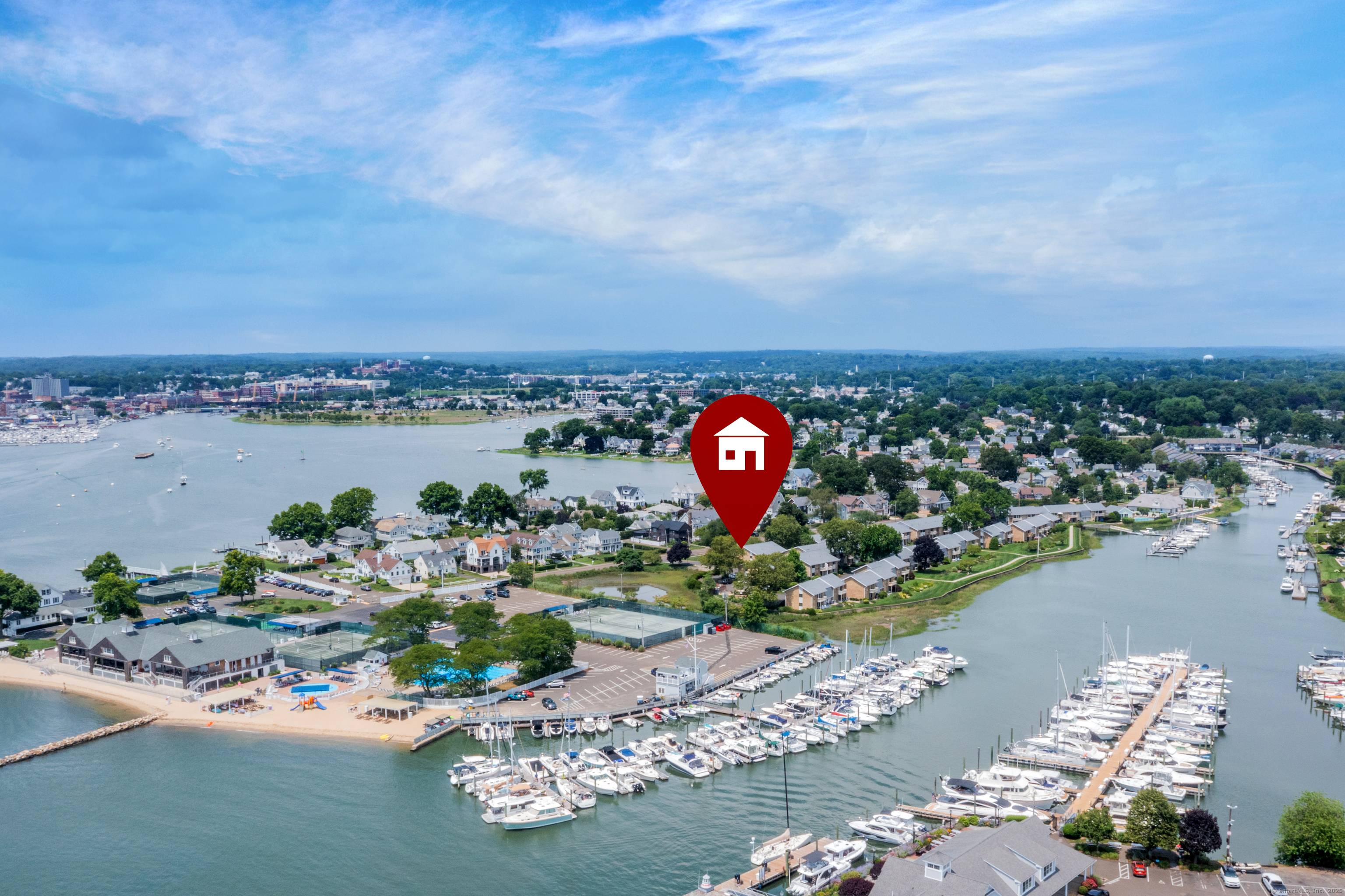 Welcome to this sunny and bright corner unit with water views over Long Island Sound.