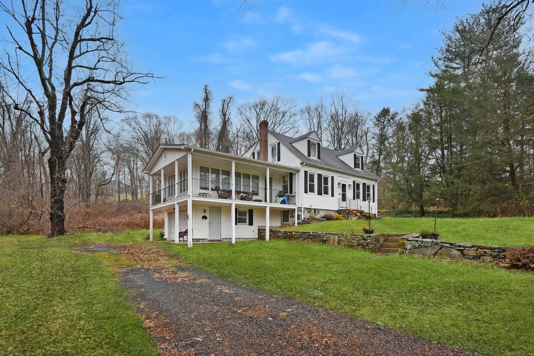 Welcome to this charming 4 bedroom, 2 full bath Cape set on nearly 5 private acres directly next to Hurd State Park.