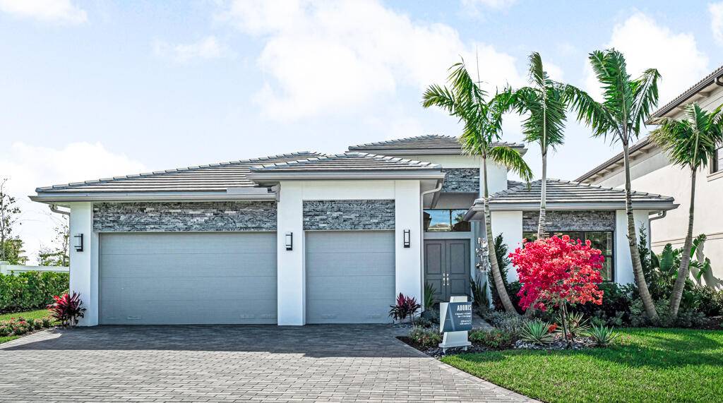 Embrace the epitome of modern living in this brand new construction home, nestled within the prestigious Apex at Avenir community in Palm Beach Gardens.