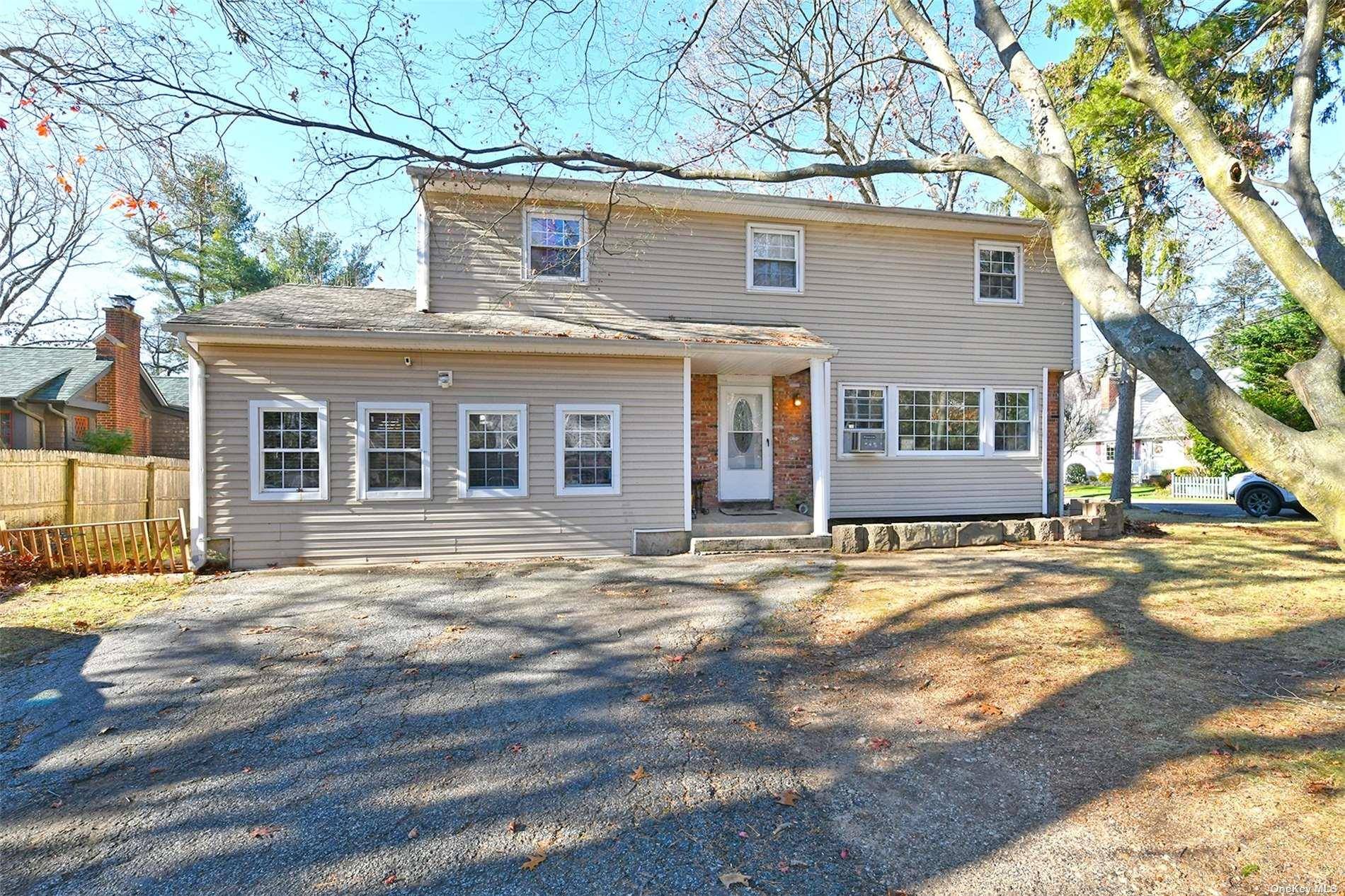 Nestled in a prime corner location in Huntington, NY, this charming 1967 5 bedroom, 3.
