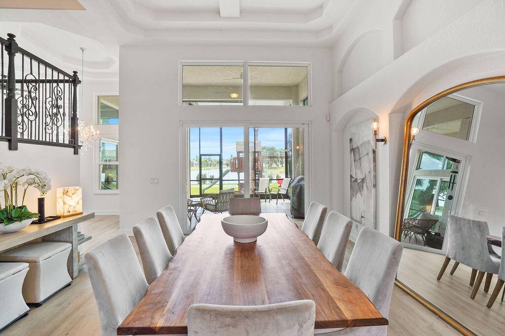 This stunning, remodeled home features lake views, outstanding community amenities, and lots of updates including a remodeled kitchen, master bathroom, all new flooring throughout, new interior paint, impact windows and ...