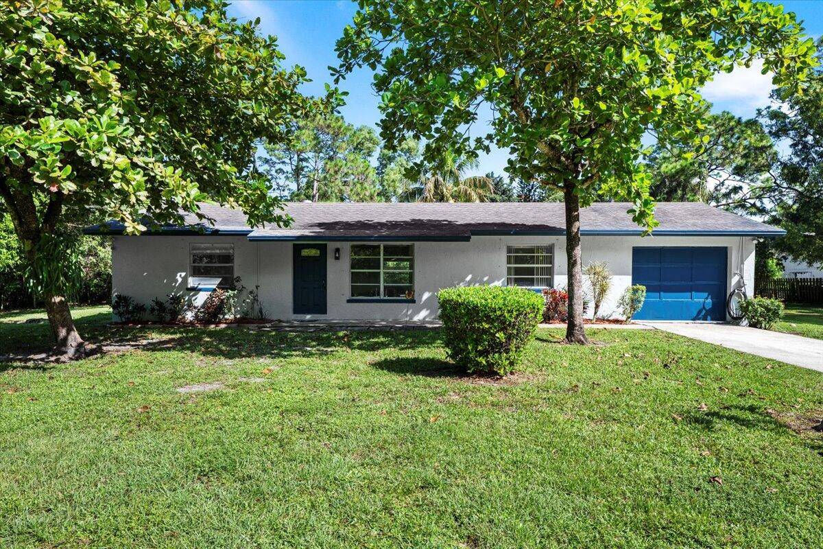 Welcome to this beautifully updated 3 bedroom, 2 bath home with a 1 car garage, perfectly situated on over an acre of land.