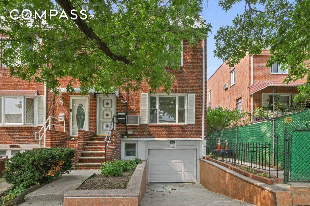 Welcome to this meticulously renovated single family townhouse located at 89 36 Springfield Blvd in vibrant Queens, NY.
