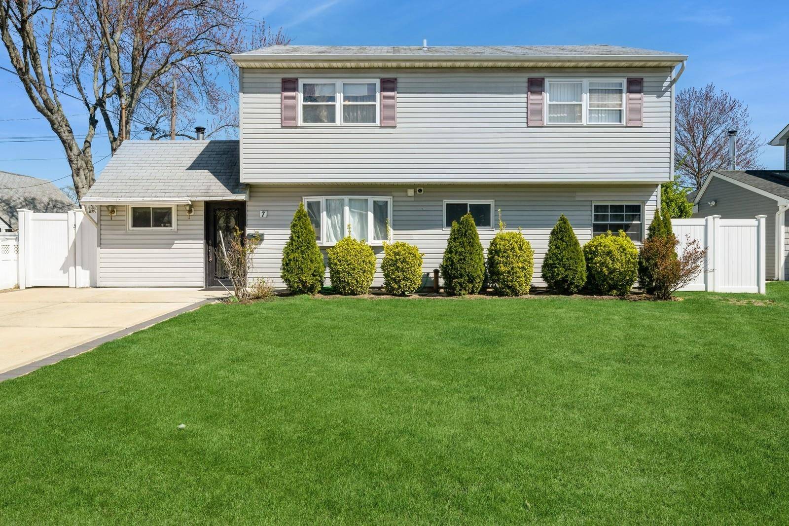Welcome to This Charming Mother Daughter Home with Proper Permits in the Heart of Hicksville !