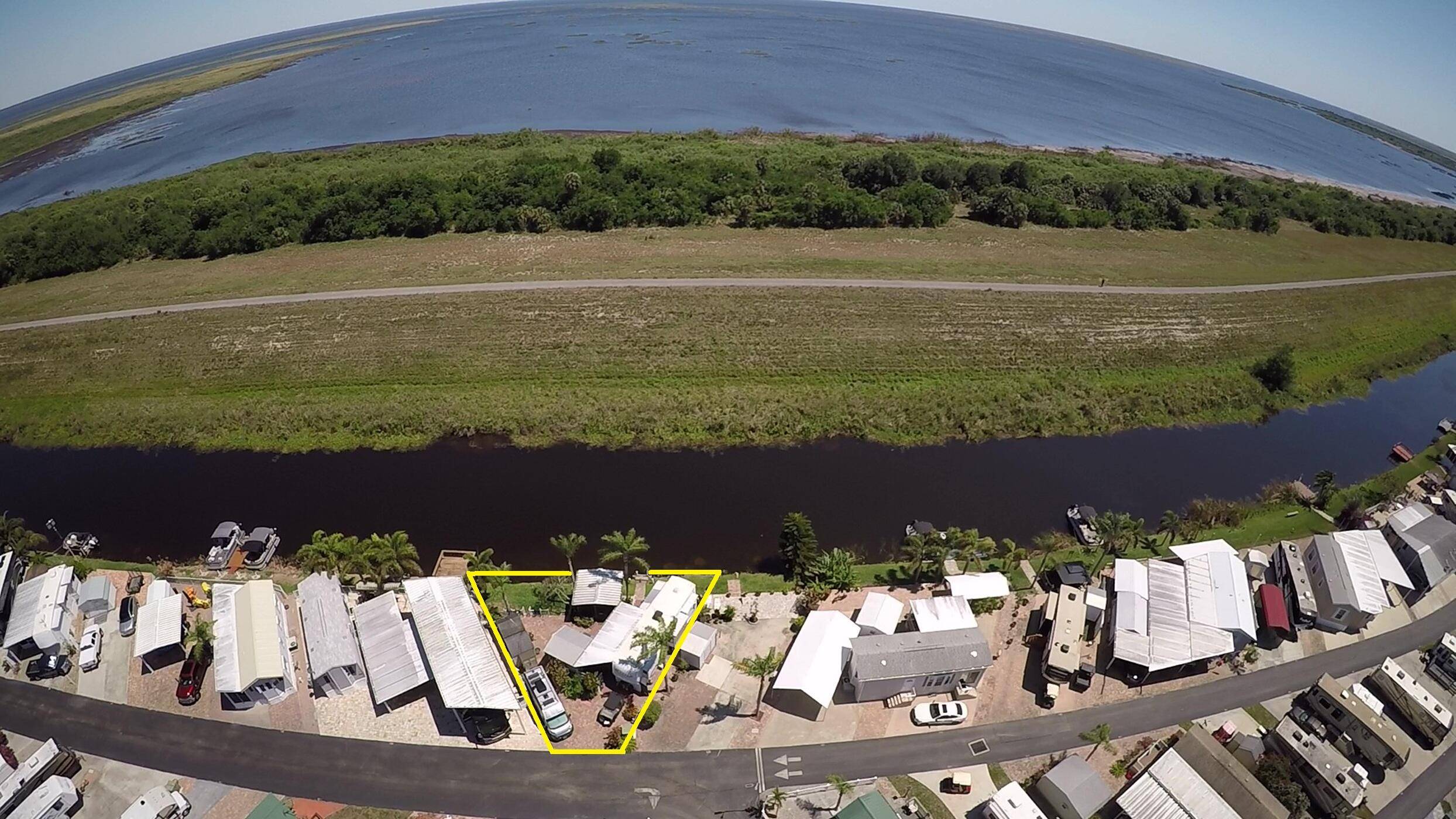 Big ''O'' RV Resort 55 community on oversized, waterfront lot, Lake O access, included 2008 fifth wheel RV, 12' x 12' screened gazebo, paver deck, multiple storage sheds, workshop, washer ...