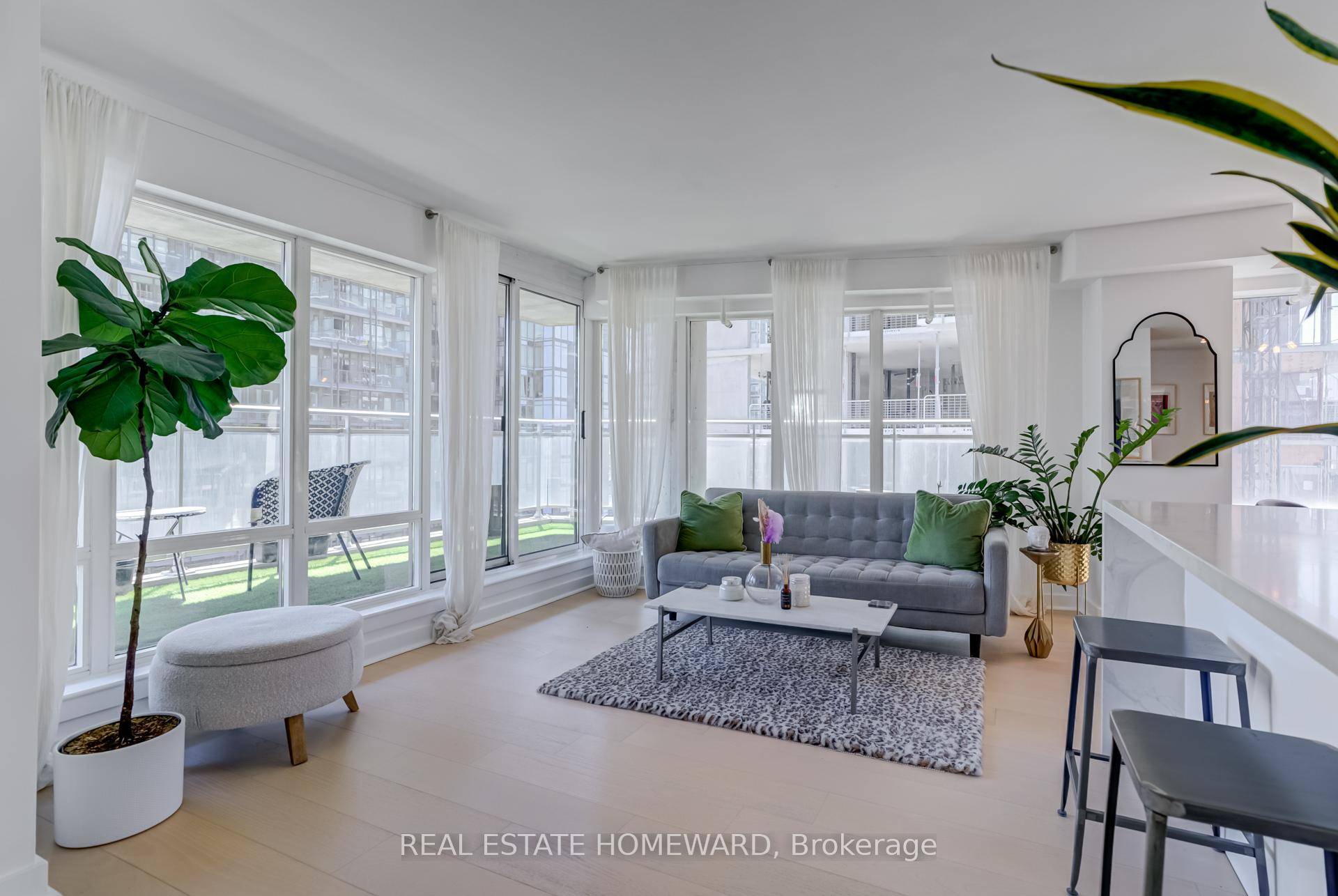 Stunning Sun filled amp ; Renovated 2 Bedroom Corner Unit with Wrap Around Terrace in the Heart of Downtown.