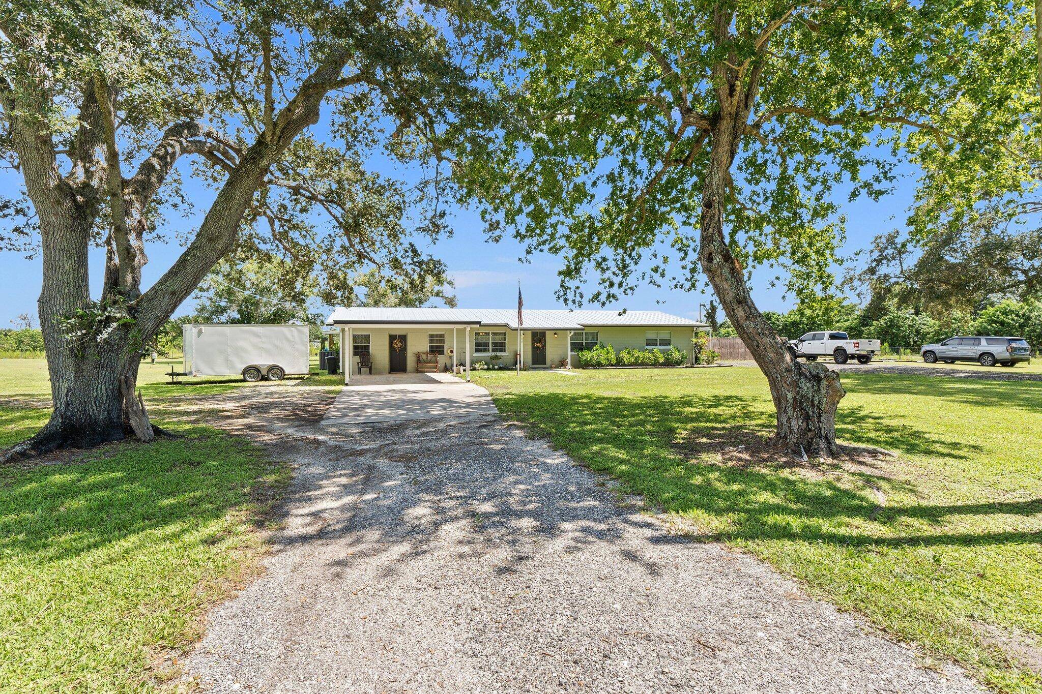 Welcome to country living at 340 N FFA Road in Fort Pierce.