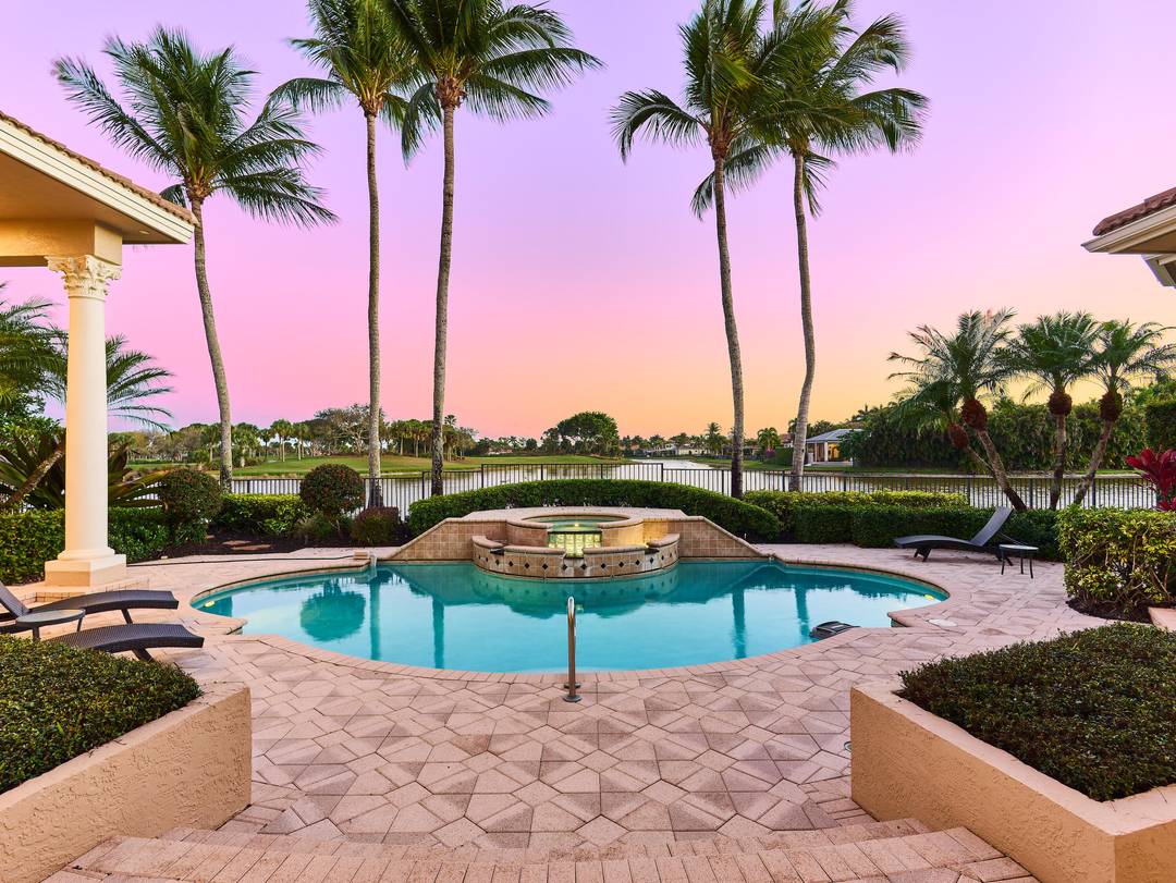 Located along one of the most prestigious streets in Ibis Country Club, often referred to as the community's famed Street of Dreams, this exceptional estate offers breathtaking long water views ...