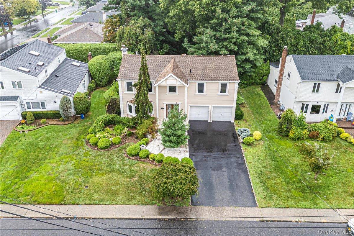 Welcome to this rarely available Colonial in Manhasset Hills !