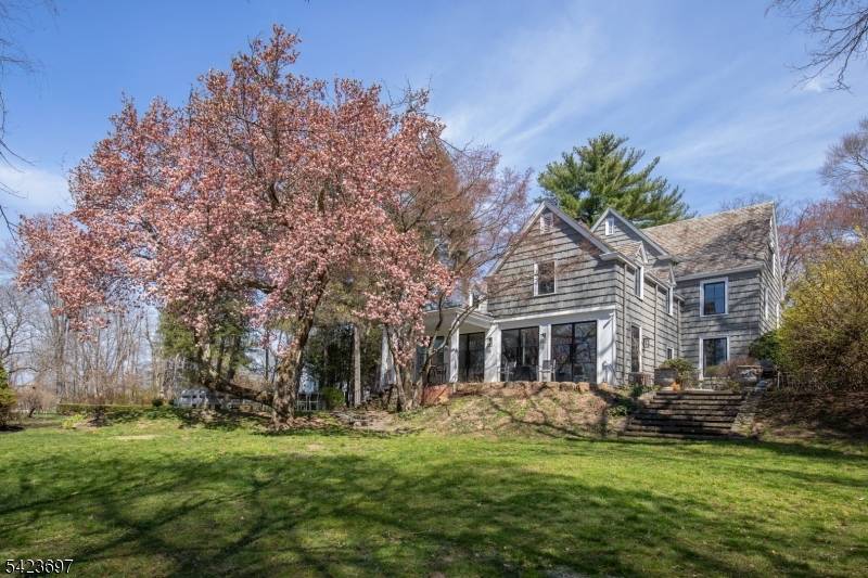 An innovative blend of classic architecture and modernist detail distinguishes this renovated custom residence with equestrian facilities.