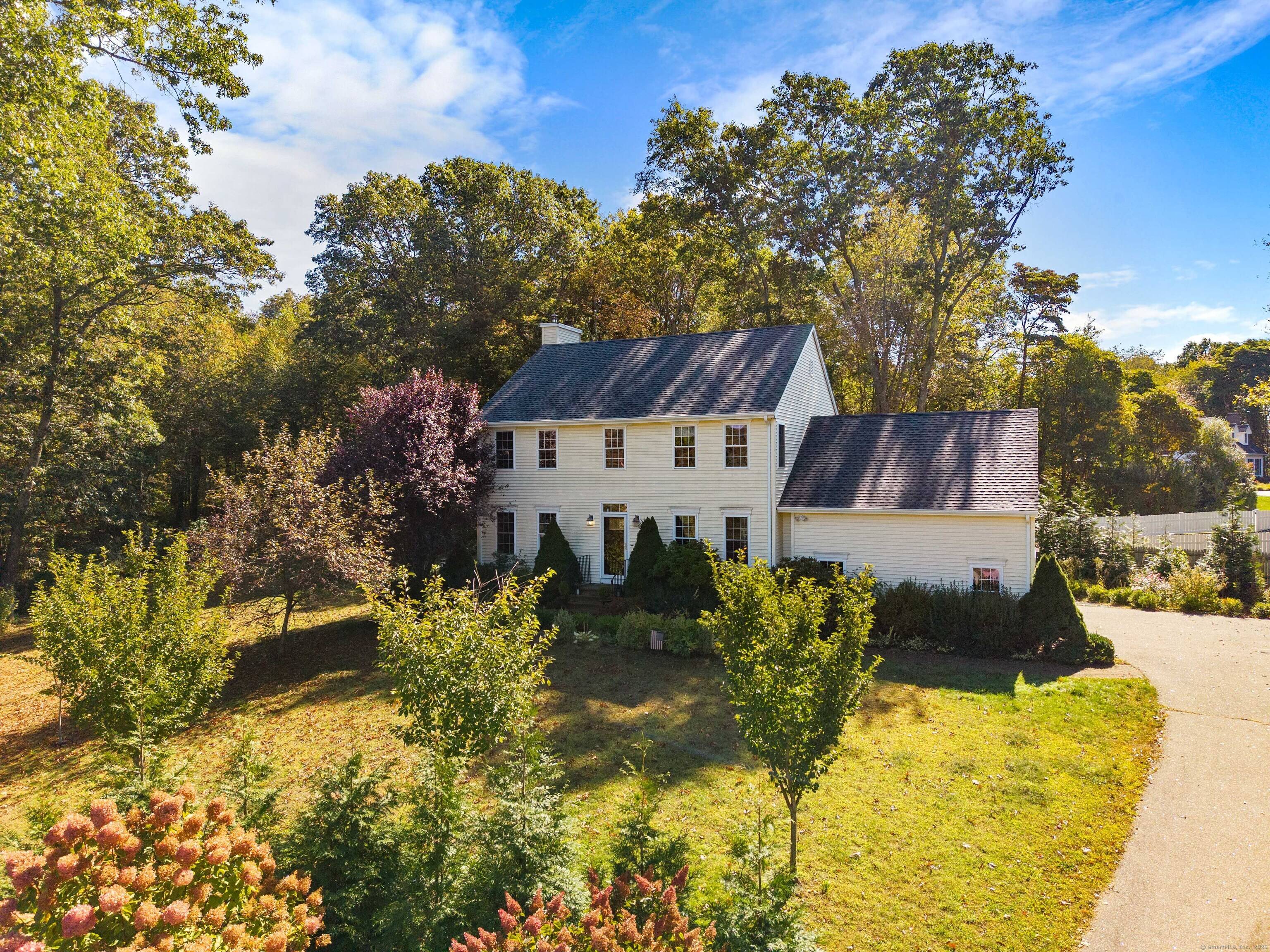 Beautiful New England Colonial set on a full acre at the end of a cul de sac !