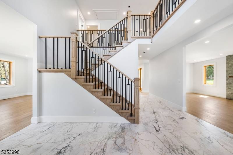 Welcome to this new luxury home set on almost an acre in one of Morganville's most sought after locations.