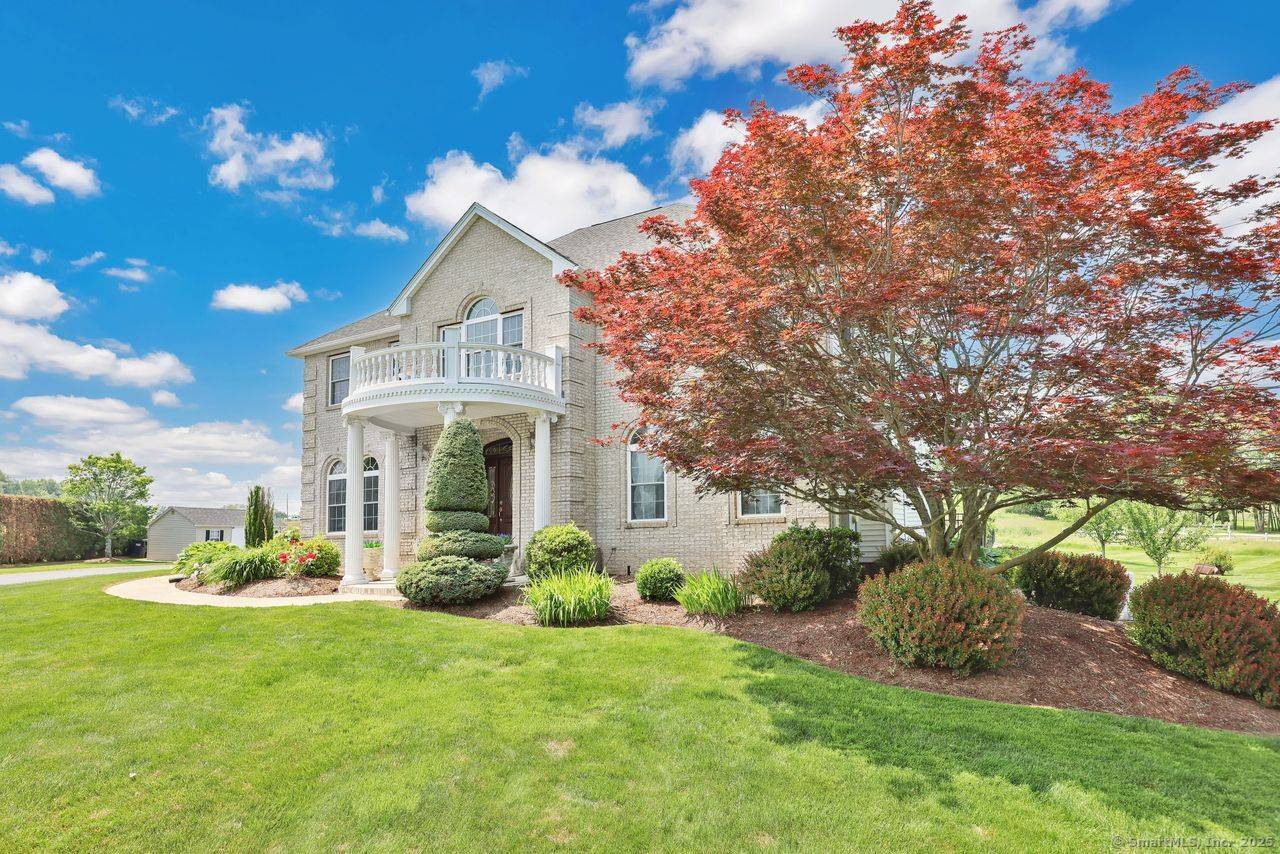 Welcome home to this spectacular sandstone brick Colonial built in 2003 with over 4100 sq ft of living space.