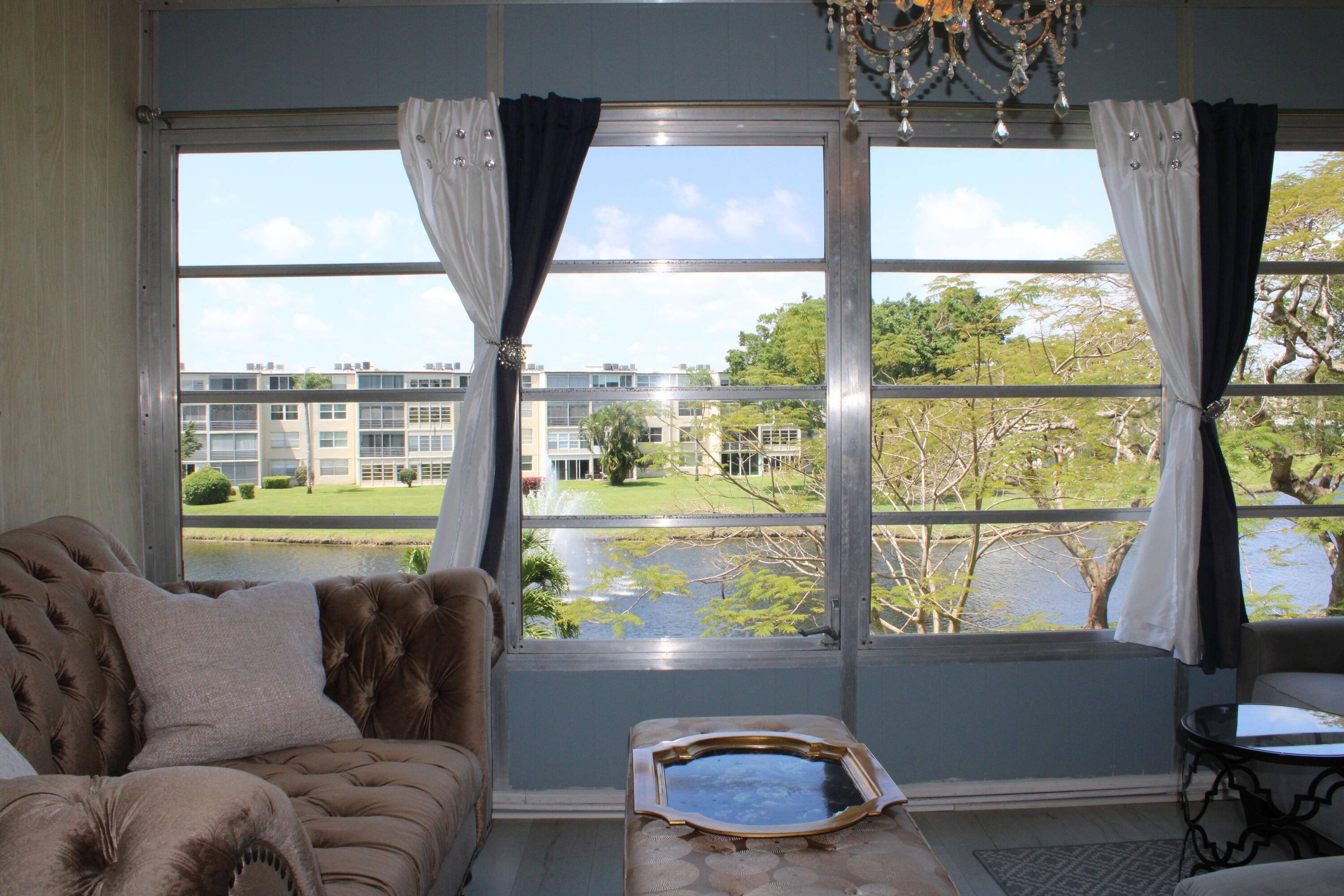 Spectacular, Direct Water Fountain Views from sunroom and bedroom Beautifully Renovated Move In Ready !