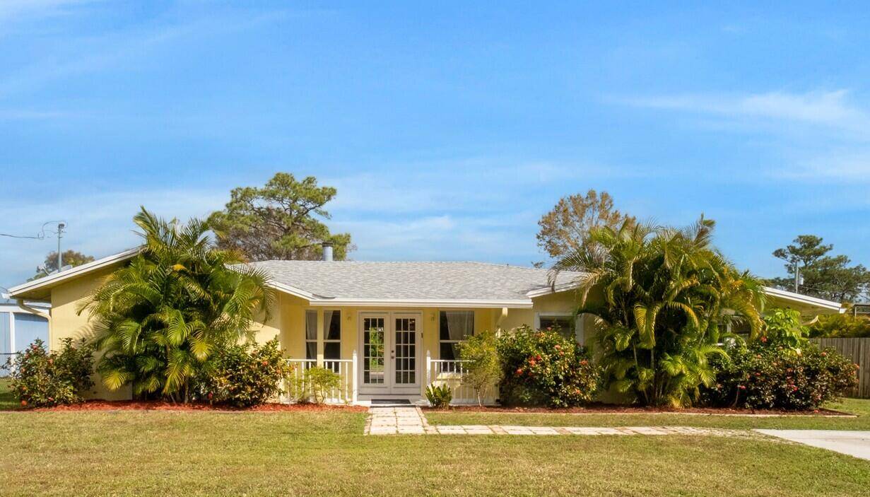 Welcome to this beautifully updated 4 bedroom, 2 bath home in the heart of Palm City !